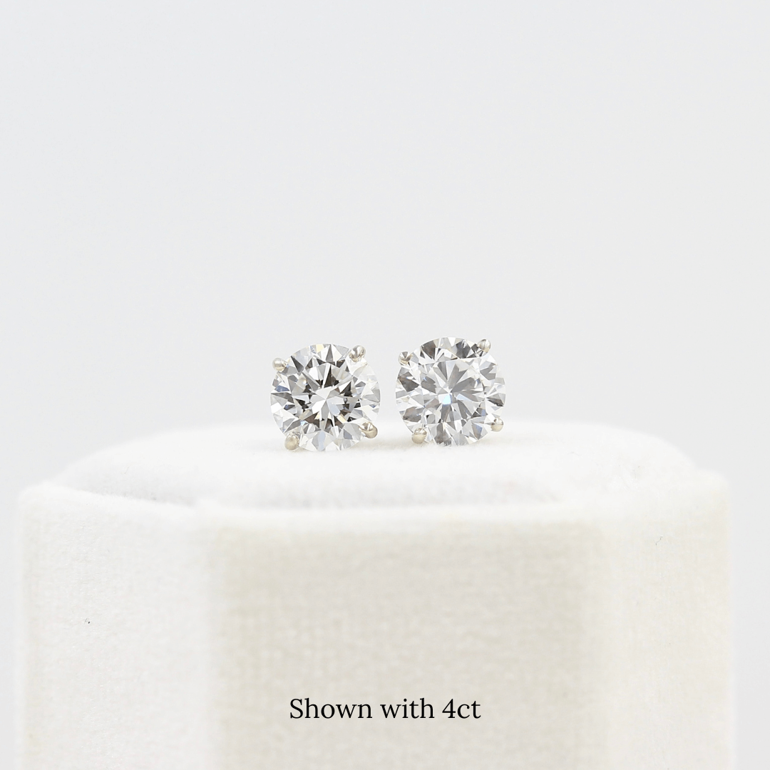 The Classic Stud Earrings in White Gold with 4ct Lab-Grown Diamond atop a white velvet ring box