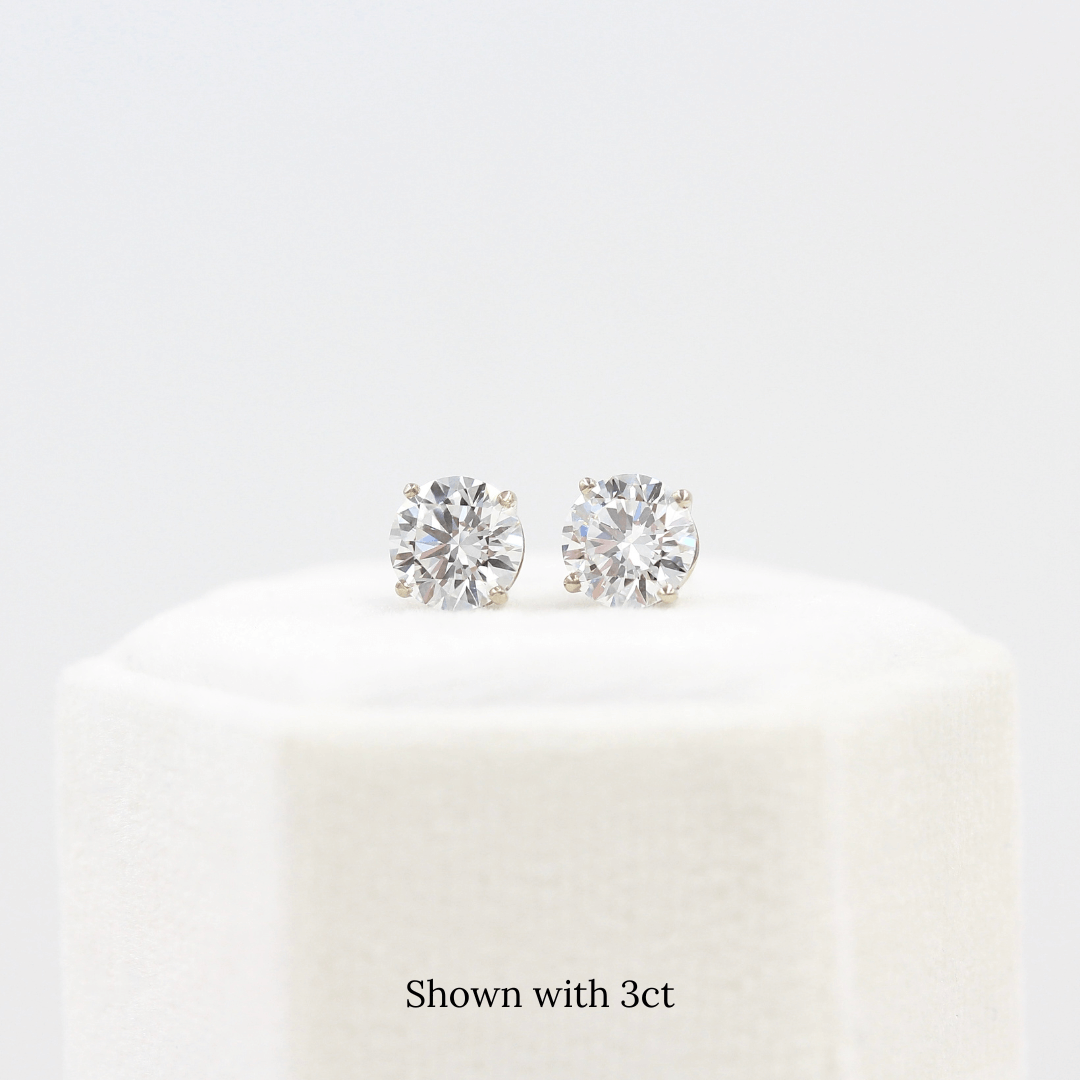 The Classic Stud Earrings in White Gold with 3ct Lab-Grown Diamond atop a white velvet ring box