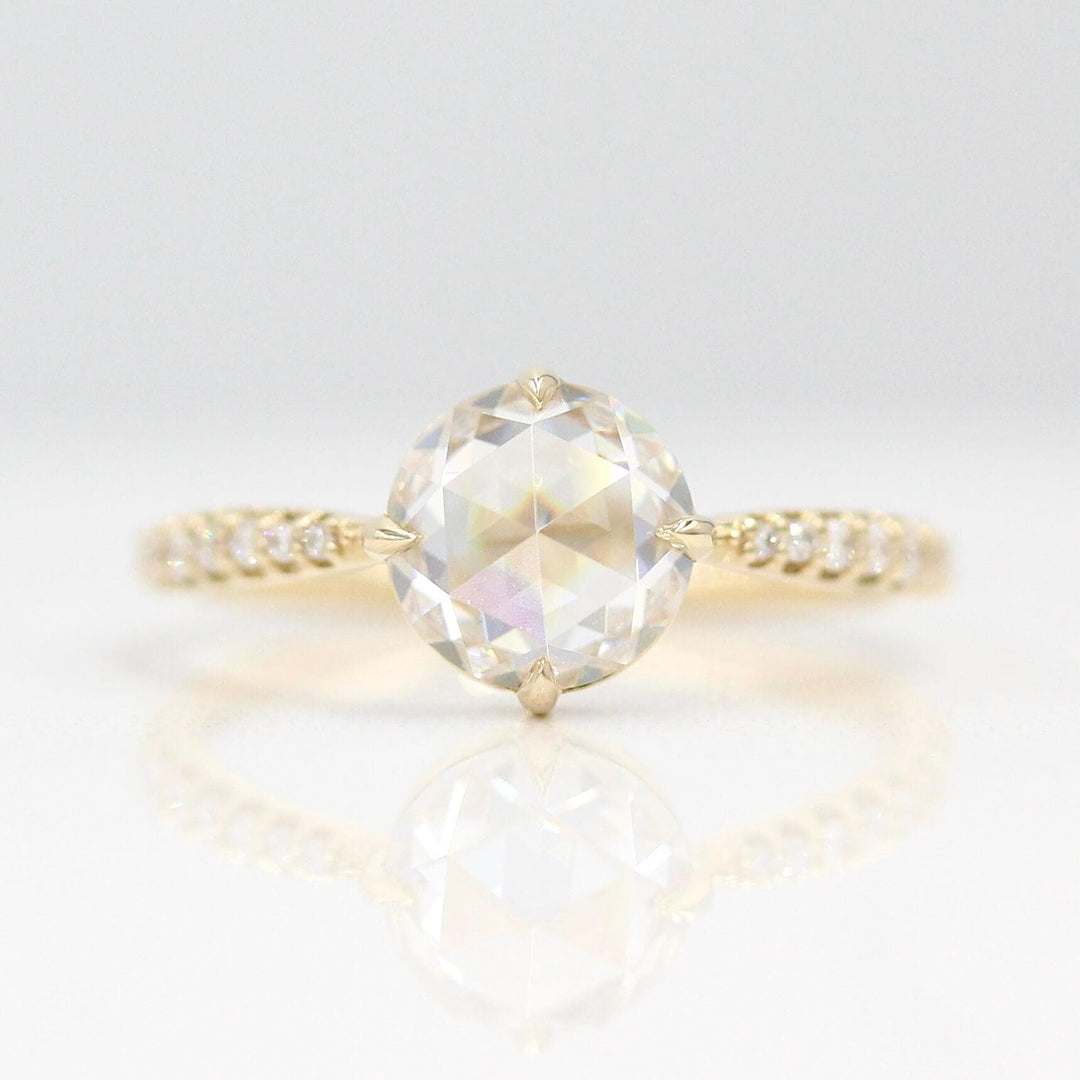 The Aurora Ring (Round) in Yellow Gold with 1.5ct Moissanite against a white background