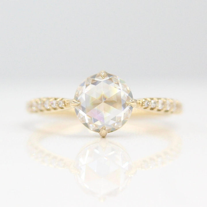 The Aurora Ring (Round) in Yellow Gold with 1.5ct Moissanite against a white background