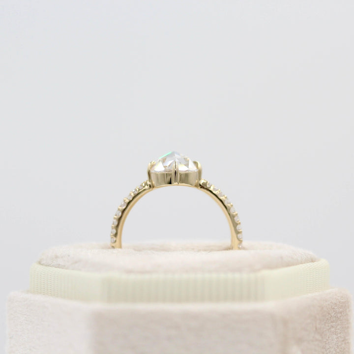 The Aurora Ring (Round) in Yellow Gold with 1.5ct Moissanite in a white velvet ring box