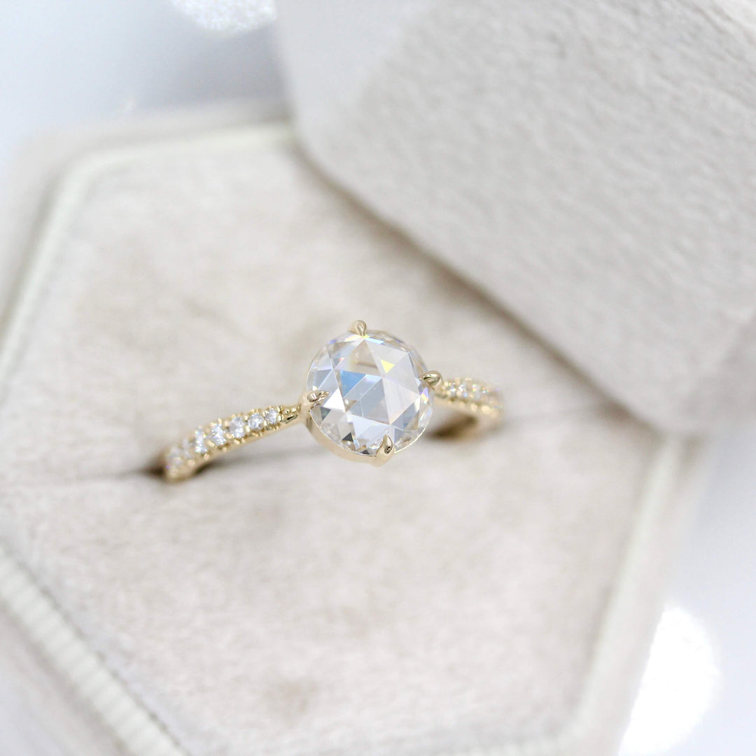 The Aurora Ring (Round) in Yellow Gold with 1.5ct Moissanite in a white velvet ring box