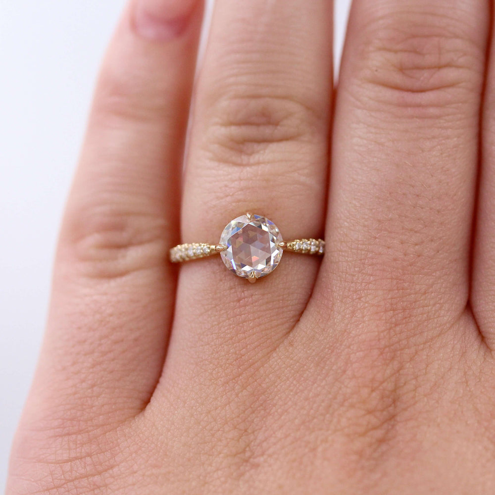 The Aurora Ring (Round) in Yellow Gold with 1.5ct Moissanite modeled on a hand