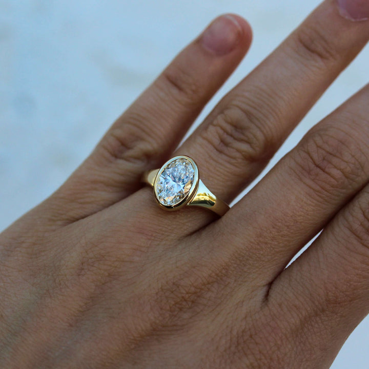 The Billie Ring (Oval) in Yellow Gold with 2ct Lab-Grown Diamond modeled on a hand