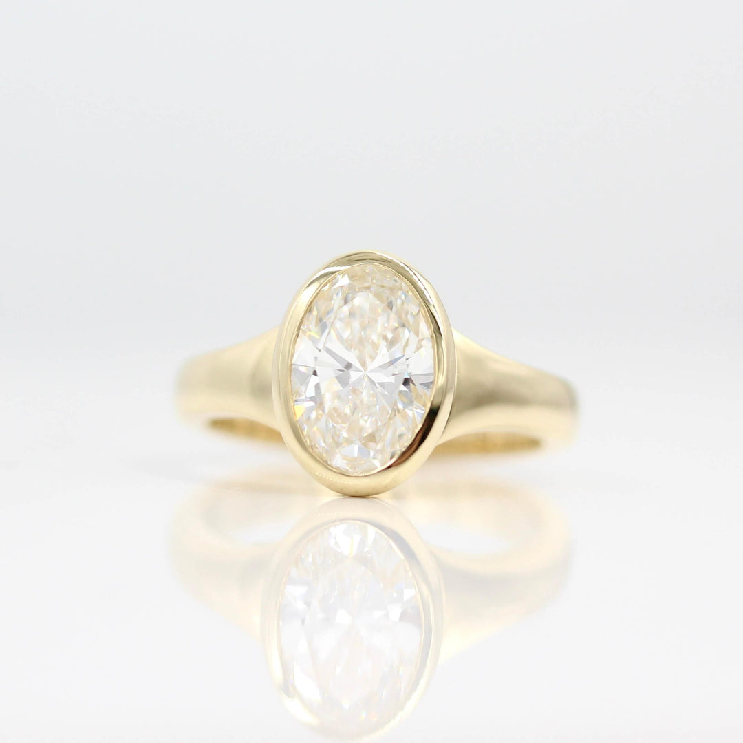 The Billie Ring (Oval) in Yellow Gold with 2ct Lab-Grown Diamond against a white background