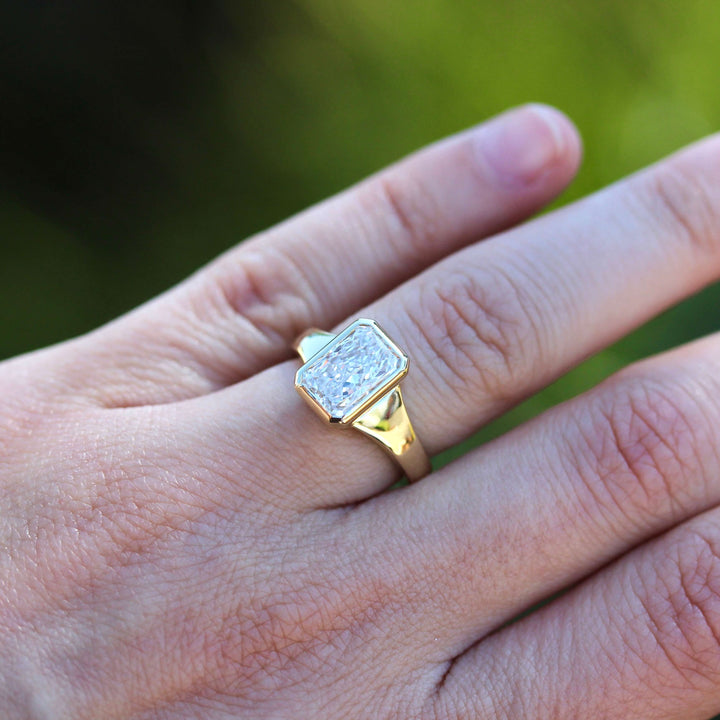 The Billie Ring (Radiant) in Yellow Gold with 2ct LGD modeled on a hand