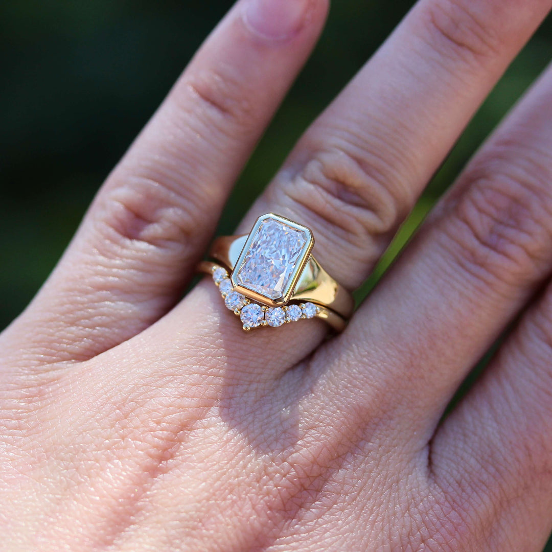 The Billie Ring (Radiant) in Yellow Gold with 2ct LGD stacked with the Tiara wedding band in yellow gold modeled on a hand