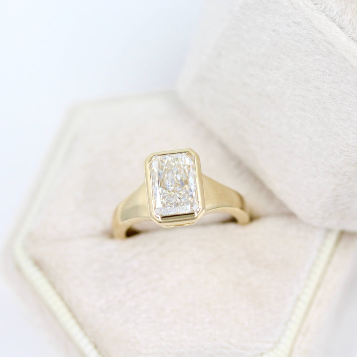 The Billie Ring (Radiant) in Yellow Gold with 2ct LGD in a white velvet ring box