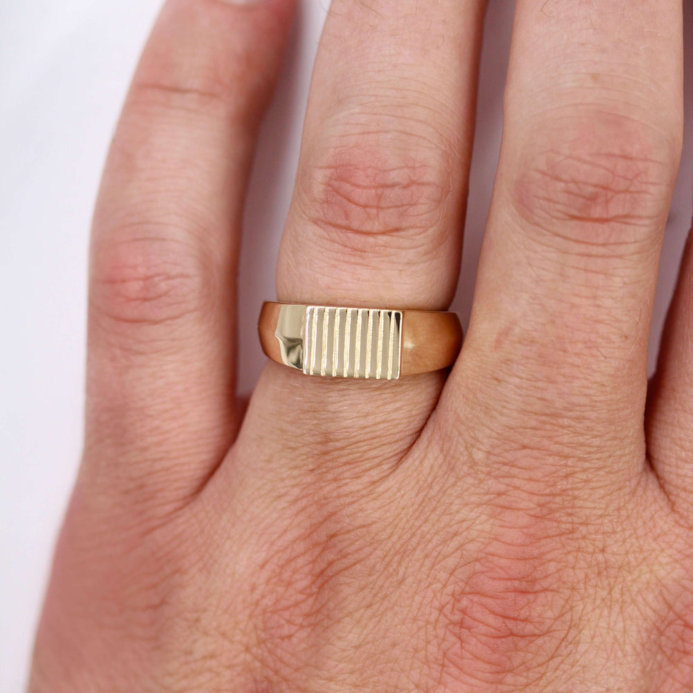 The Blake Ring in Yellow Gold modeled on a hand