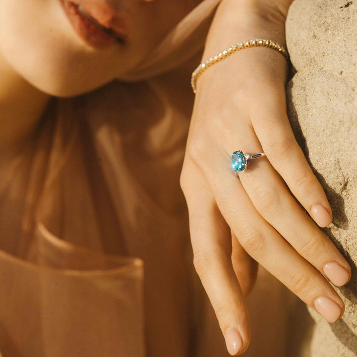 The Esme Ring (Oval) in White Gold with 1.61ct Blue Lab-Grown Diamond modeled on a hand