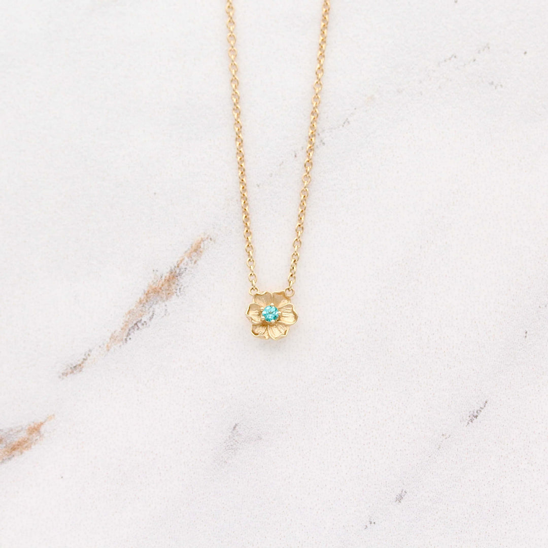 The August Birthstone Poppy Necklace with Chrysoberyl in Yellow Gold against a white background