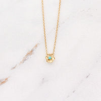 The August Birthstone Poppy Necklace with Chrysoberyl in Yellow Gold against a white background