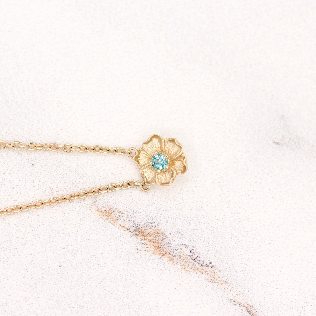 The August Birthstone Poppy Necklace with Chrysoberyl in Yellow Gold against a white background