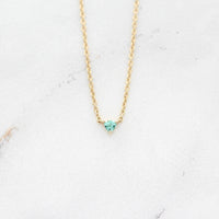 The August Birthstone Tiny Trillion Necklace with Chrysoberyl in Yellow Gold against a white background