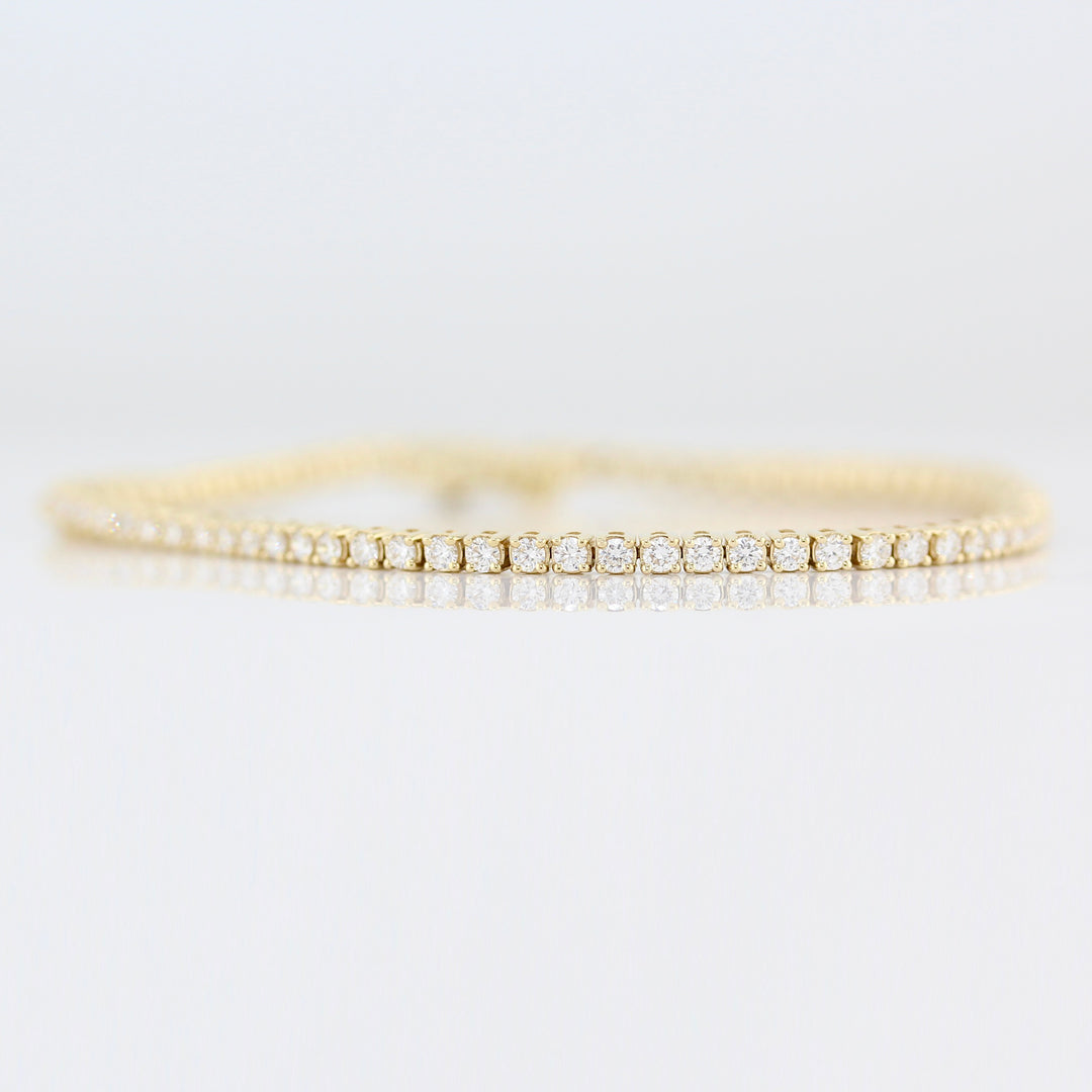 The Classic Lab-Grown Diamond Tennis Bracelet in Yellow Gold against a white background