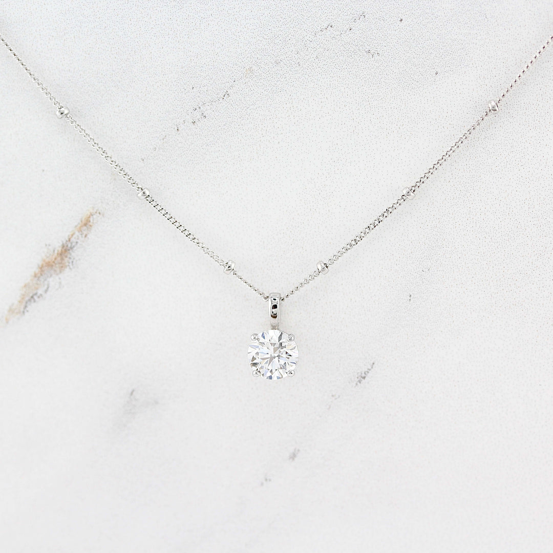 The Janelle Necklace in White Gold against a white background
