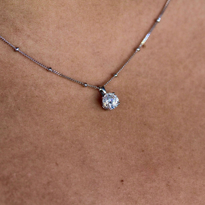 The Janelle Necklace in white gold modeled on a neck