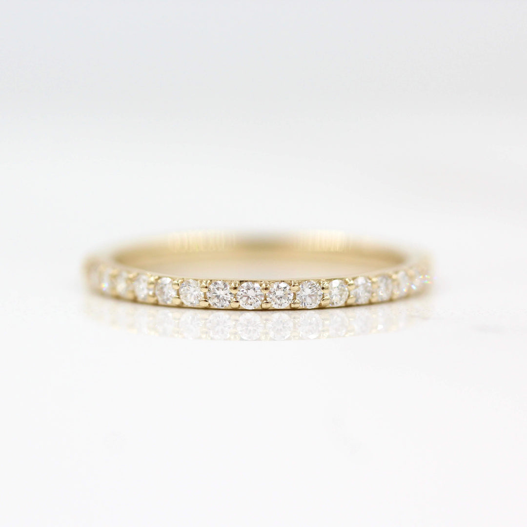 The Petite Elizabeth Wedding Band in Yellow Gold against a white background