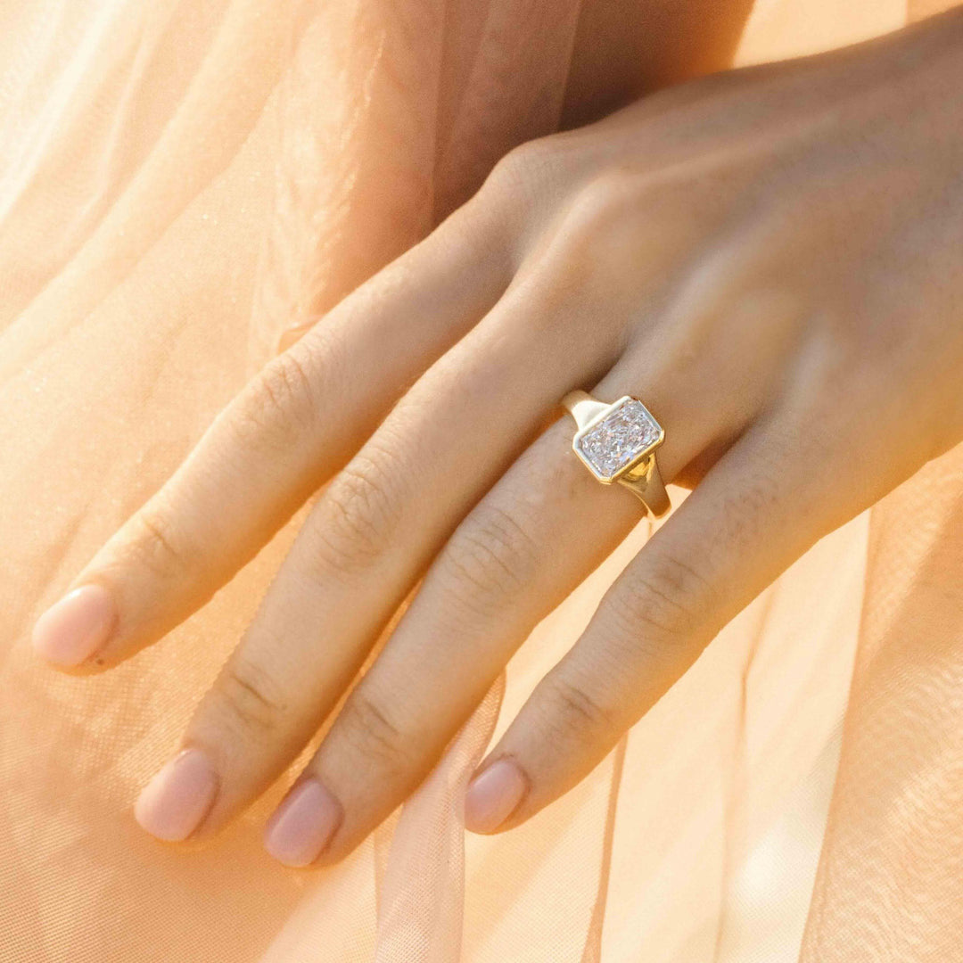 The Billie Ring (Radiant) in Yellow Gold with 2.03ct Lab-Grown Diamond modeled on a hand