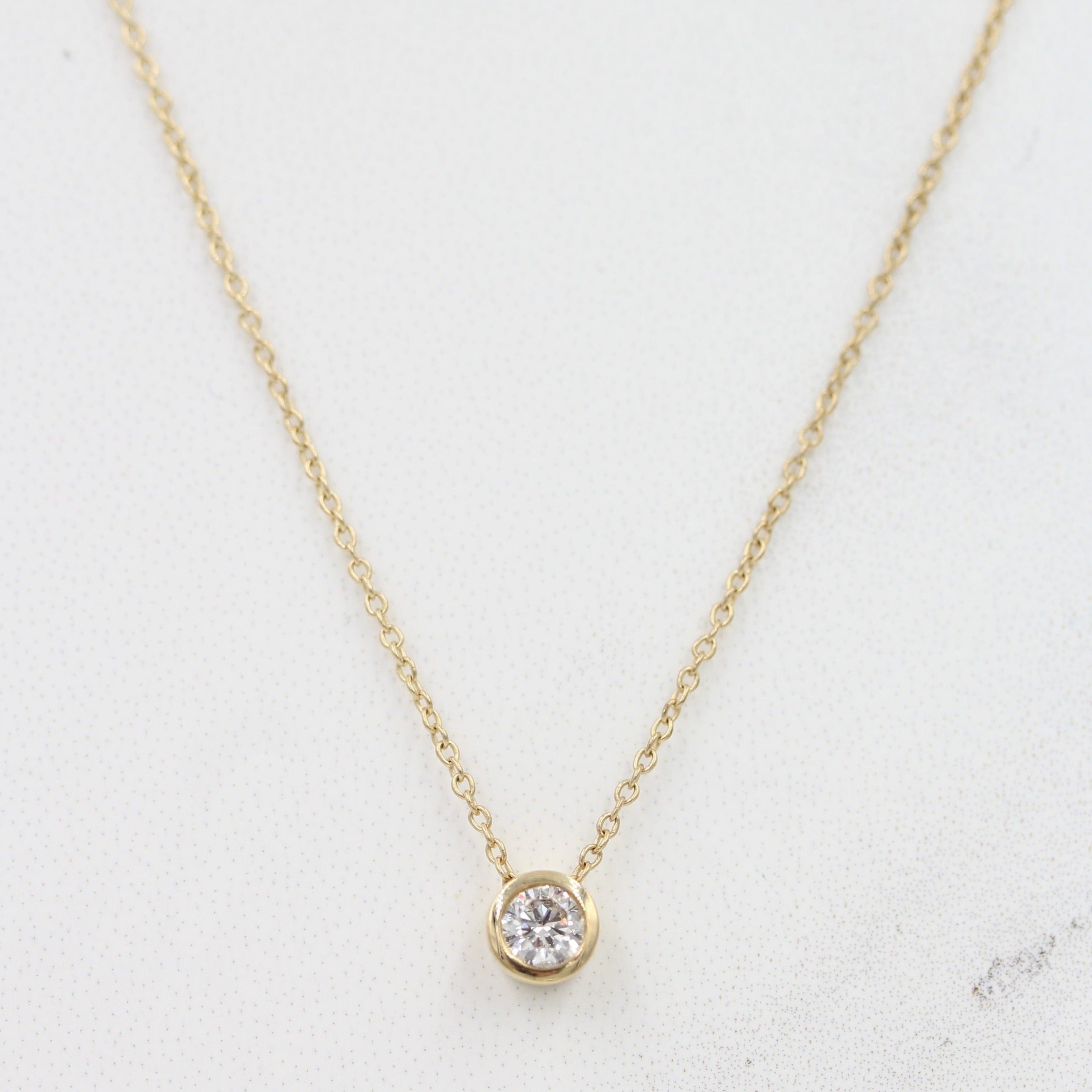 Yellow gold bezel diamond on sale necklace