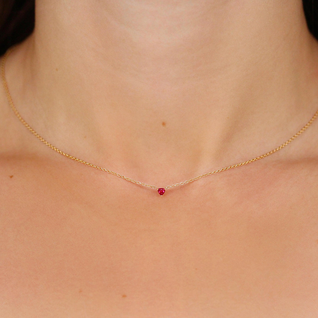 The July Birthstone Tiny Trillion Necklace with Ruby in Yellow Gold modeled