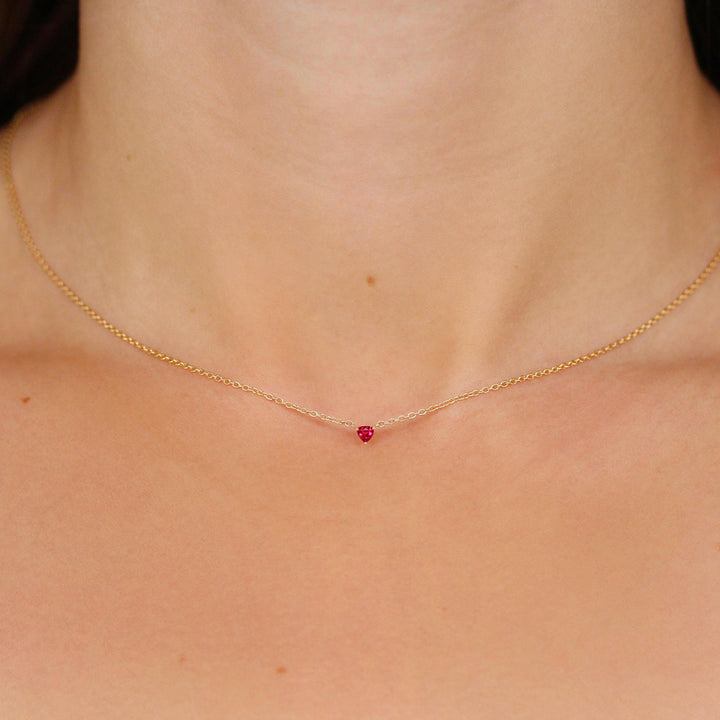 The July Birthstone Tiny Trillion Necklace with Ruby in Yellow Gold modeled