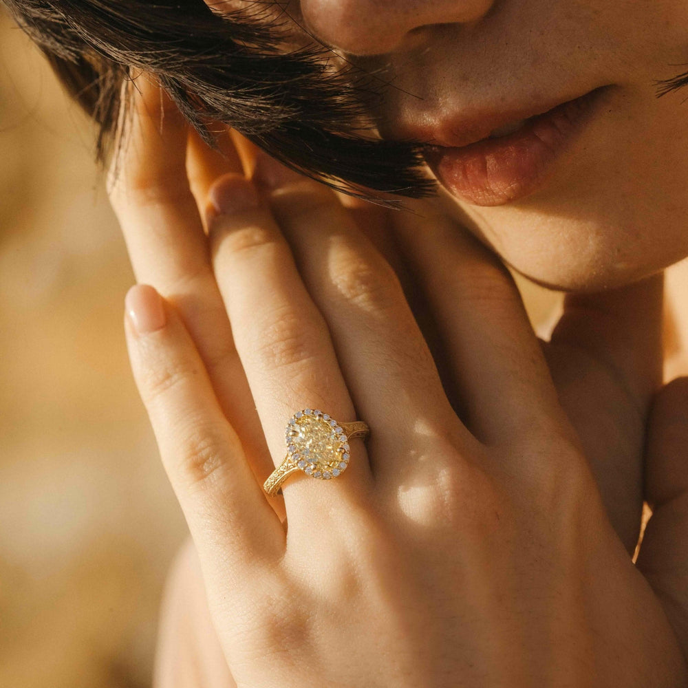 The Sabrina Ring (Oval) in Yellow Gold with 2.03ct Yellow Lab-Grown Diamond modeled on a hand