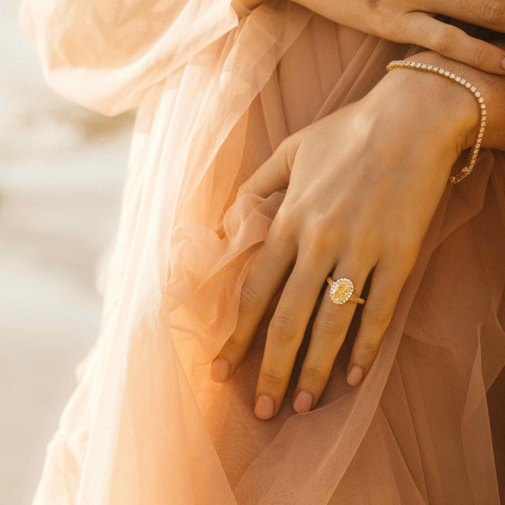 The Sabrina Ring (Oval) in Yellow Gold with 2.03ct Yellow Lab-Grown Diamond modeled on a hand