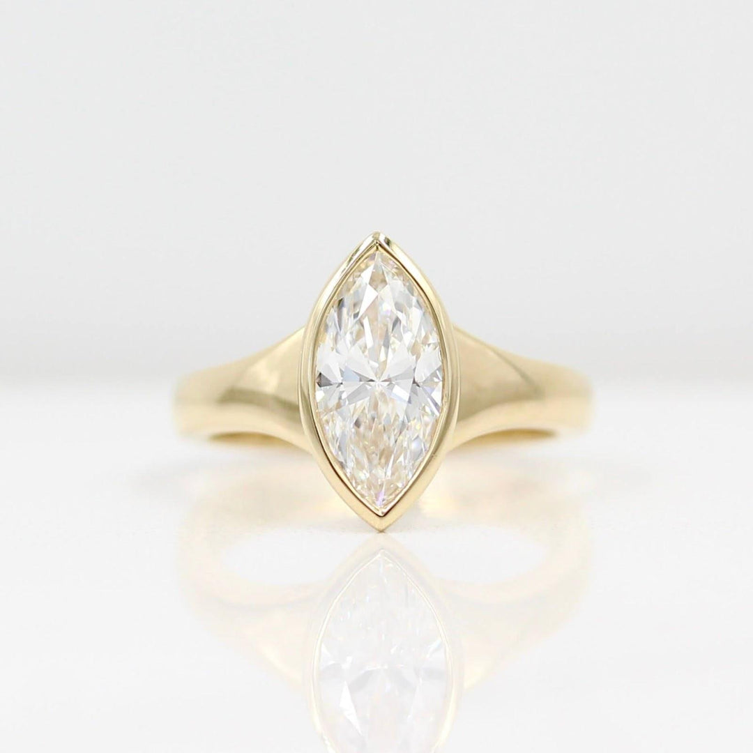 marquise bezel solitaire old money engagement ring