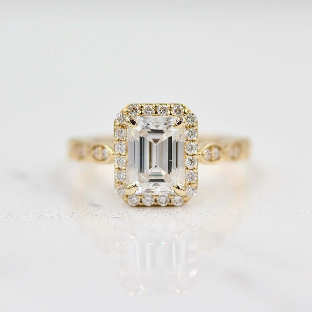 haloed emerald-cut old money engagement ring with diamond band