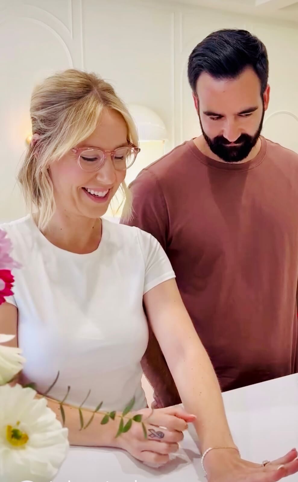 couple trying on engagement rings