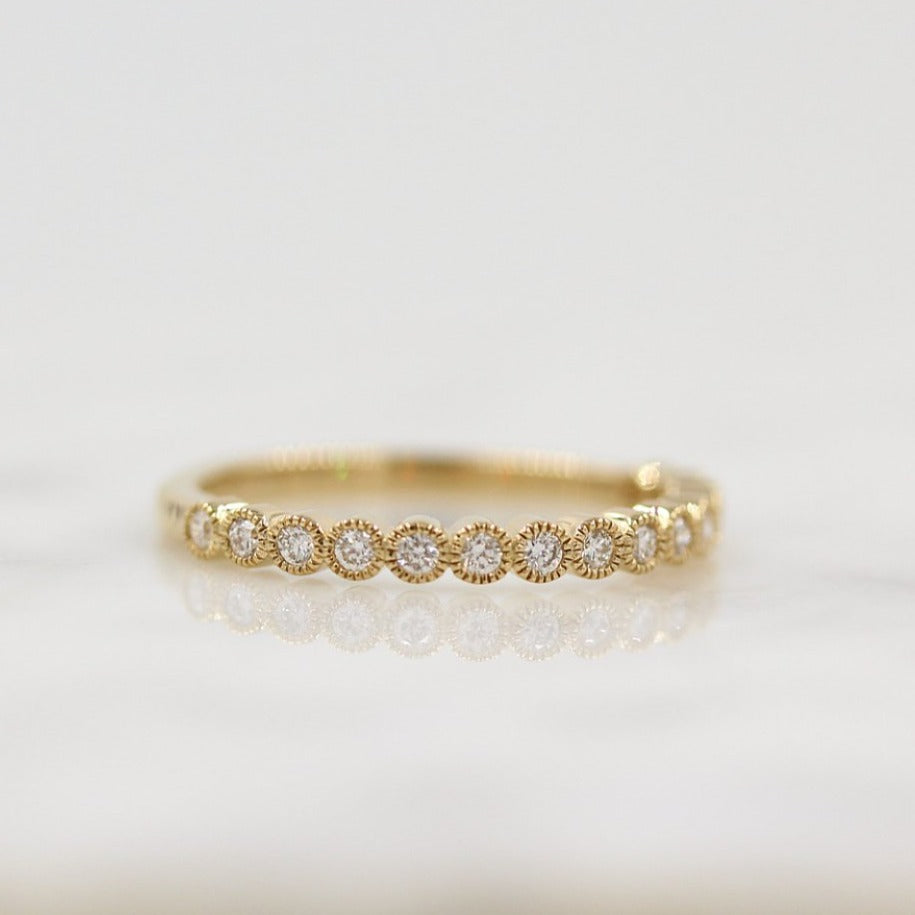 The Florence Wedding Band in Yellow Gold against a white background